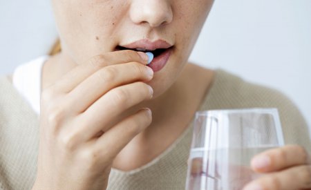 Woman taking medication