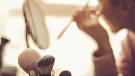 Woman putting make-up