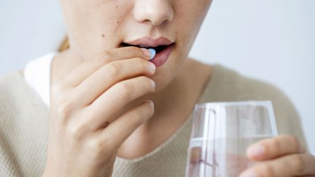 Woman taking medication