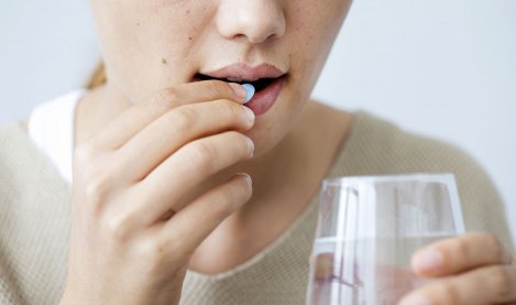 Woman taking medication