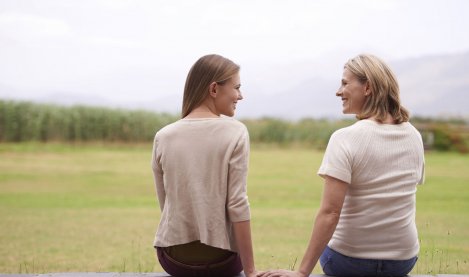 Mother and daughter sitting and together